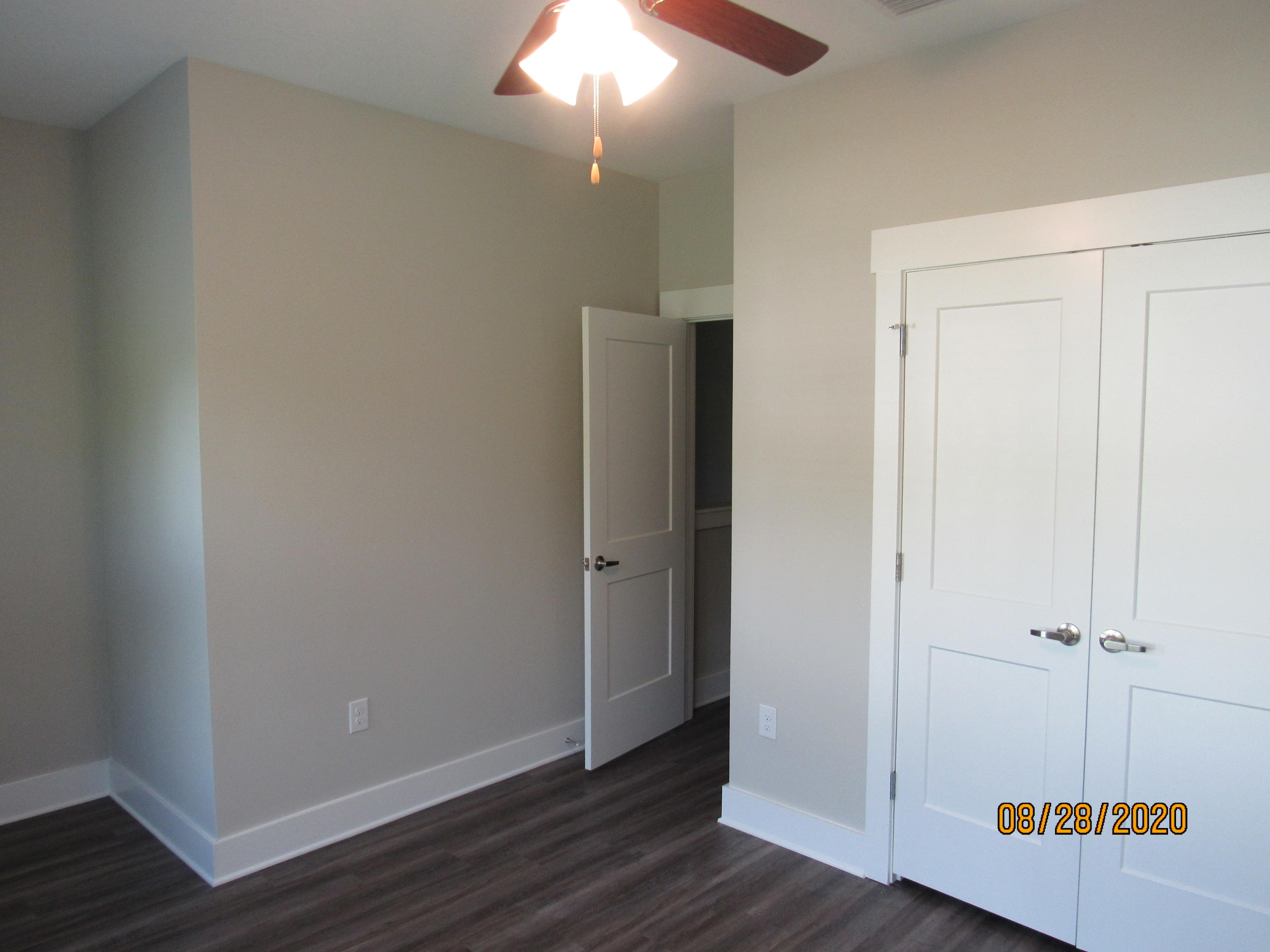 75 South Sand Palm Road Freeport, FL 32439 - Photo 16 of 18 an empty room with wooden floor and hallway