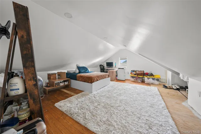 a bed room with a bed and a television