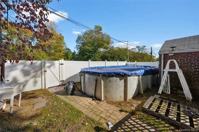 a view of a swimming pool with a patio