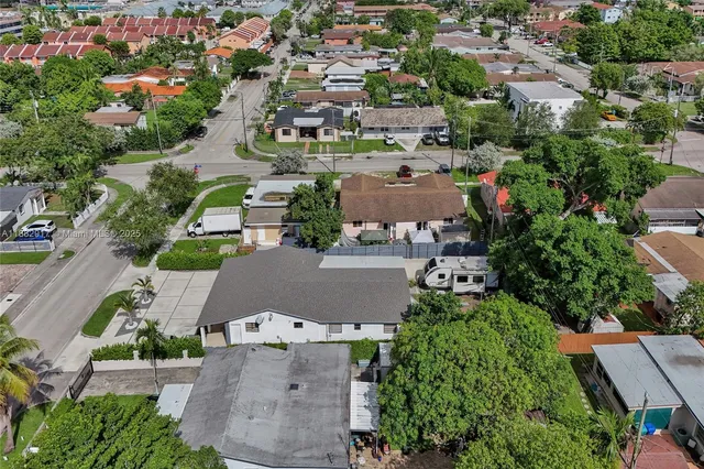 an aerial view of a city with lots of residential buildings