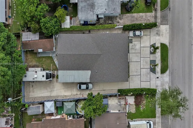 an aerial view of residential houses with outdoor space