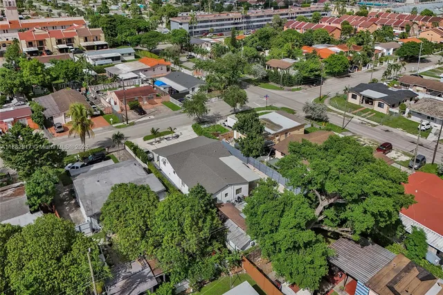 an aerial view of residential houses with outdoor space