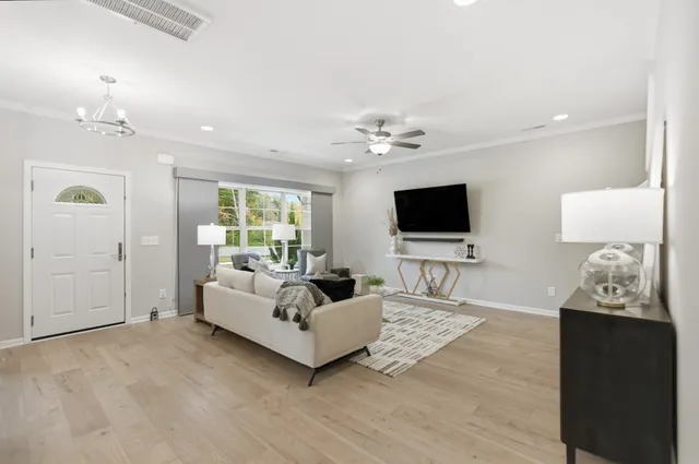 a living room with furniture and a flat screen tv