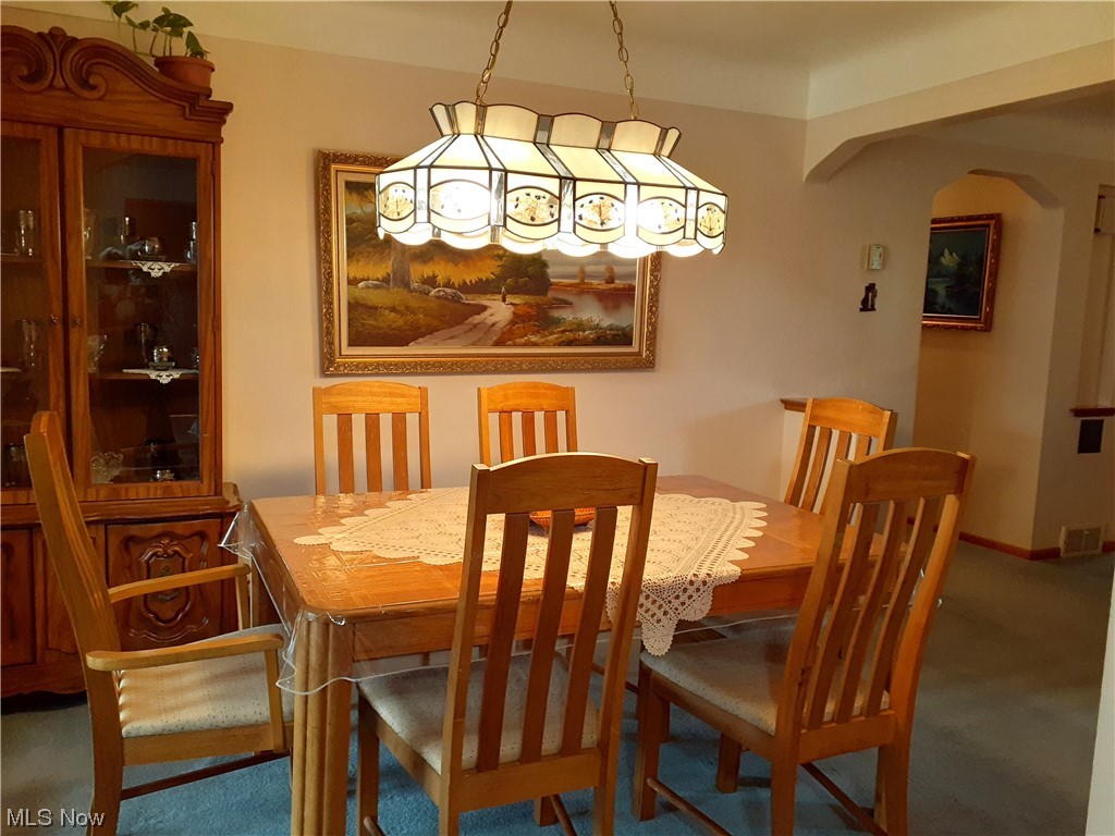 7005 Ridge Road Cleveland, OH 44129 - Photo 10 of 19 Dining space featuring dark carpet