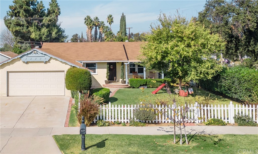 8669 Glencoe Drive Riverside, CA 92504 - Photo 1 of 1 a front view of a house with a yard