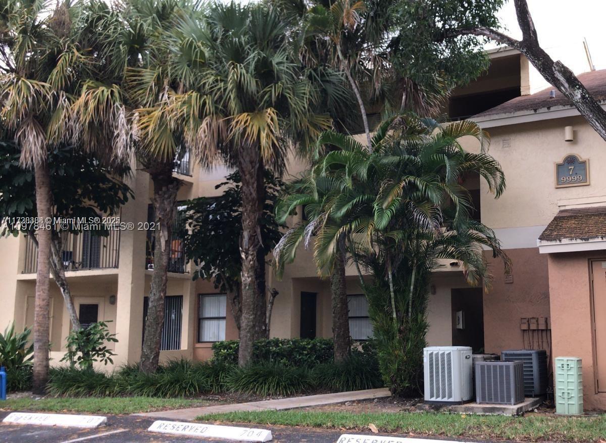 Summerbreeze Condominiums Sunrise, FL 33322 - Photo 12 of 12 a front view of a house with garden