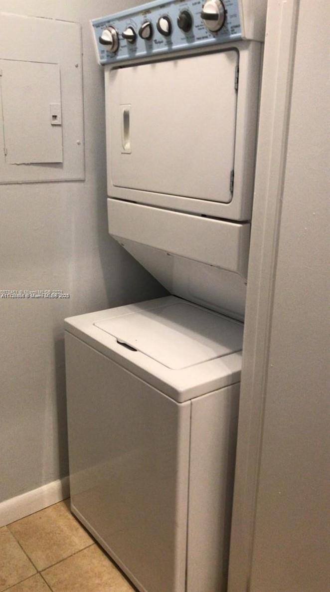 Summerbreeze Condominiums Sunrise, FL 33322 - Photo 8 of 12 a utility room with dryer and washer