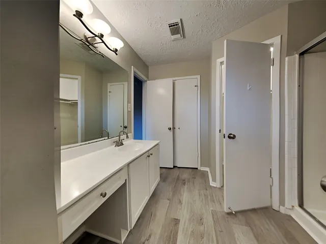 a bathroom with a sink a mirror and a bathtub