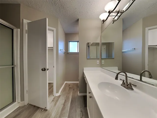 a bathroom with a sink and mirror