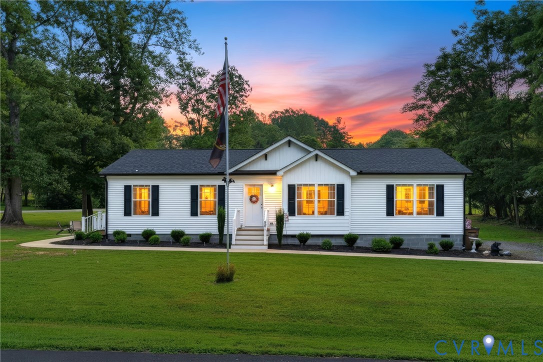 64 Pine Road Louisa, VA 23093 - Photo 1 of 53 White siding exterior with dark shutters, gabled r