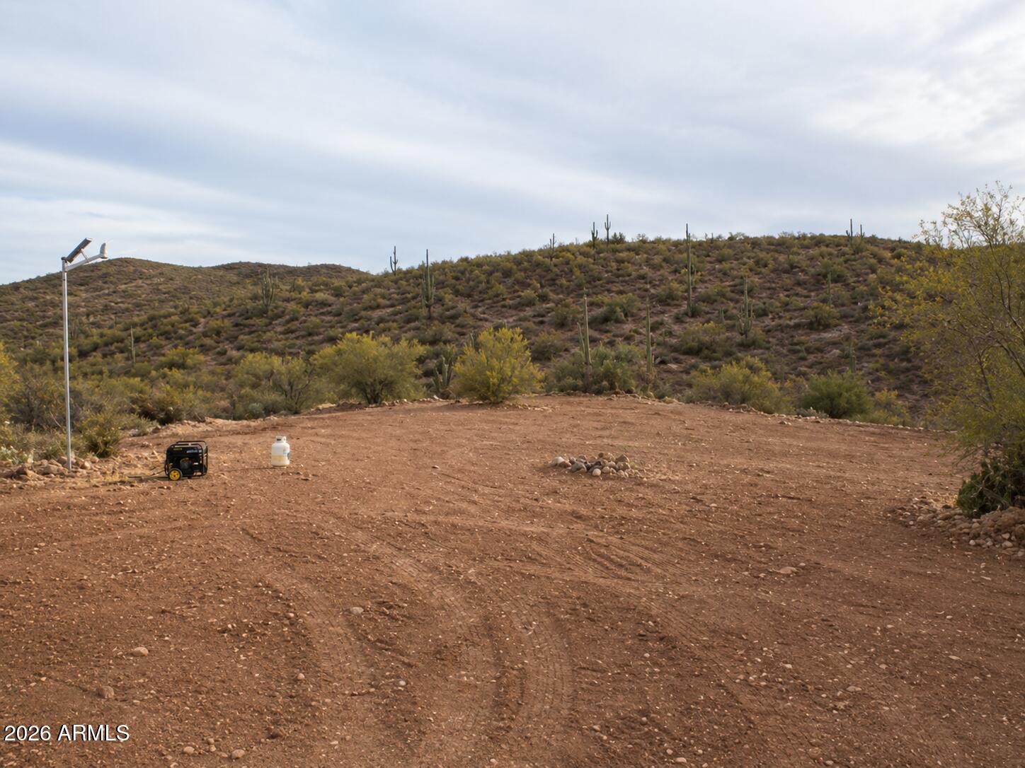 7b North Cow Creek Road, Unit 7B Morristown, AZ 85342 - Photo 11 of 18 a view of a dry yard with wooden fence