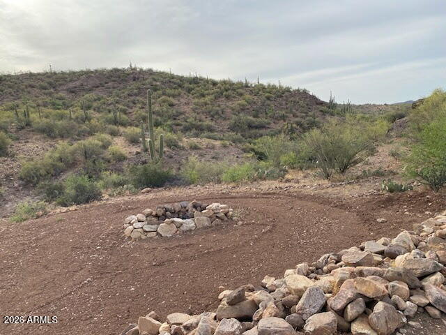 7b North Cow Creek Road, Unit 7B Morristown, AZ 85342 - Photo 13 of 18 a view of a road with a mountain view in the back
