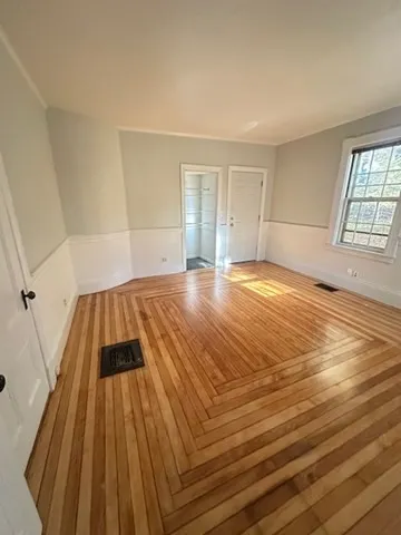 wooden floor in a room with a window