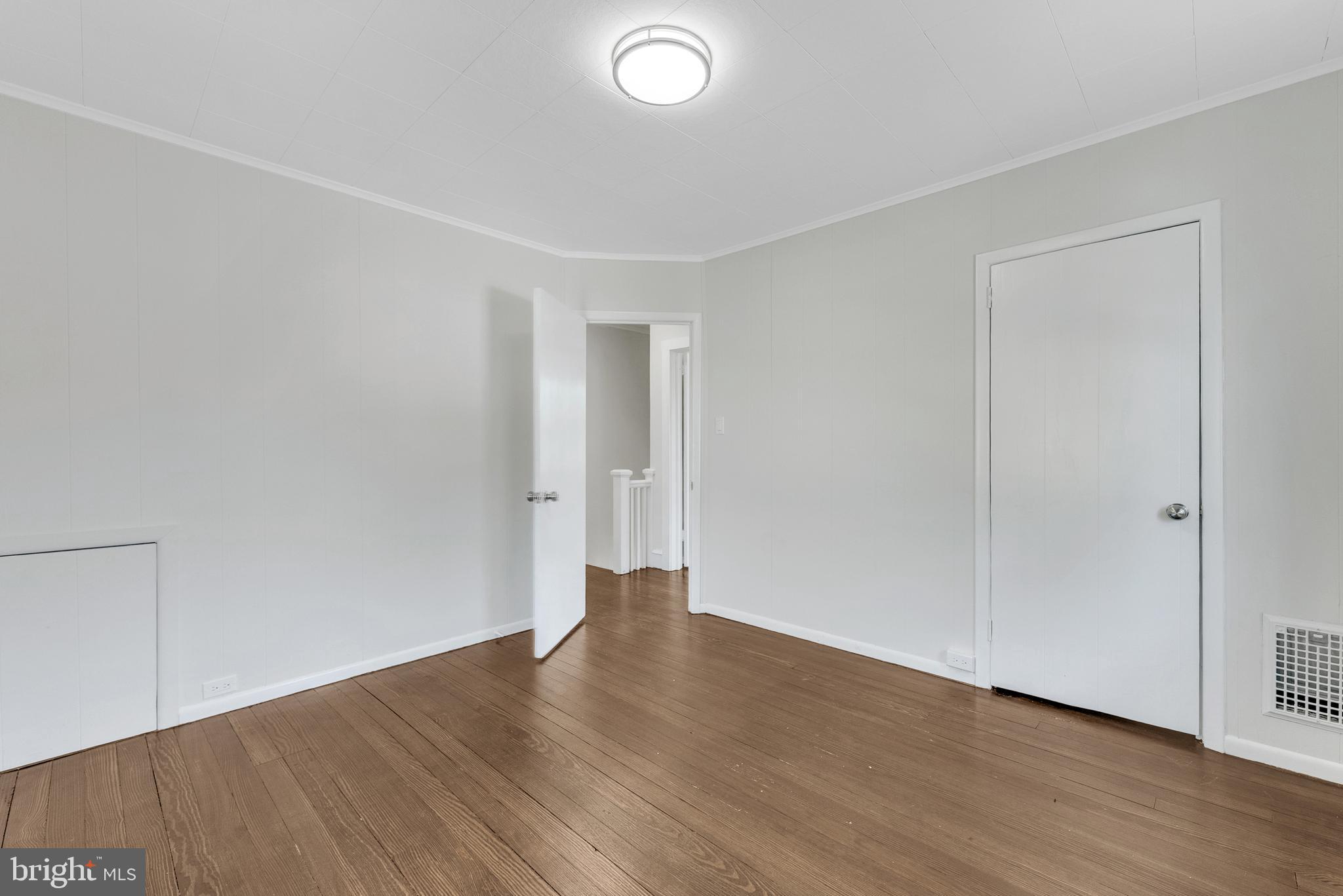217 Pennsylvania Road Brooklawn, NJ 08030 - Photo 16 of 21 a view of an empty room with wooden floor and closet