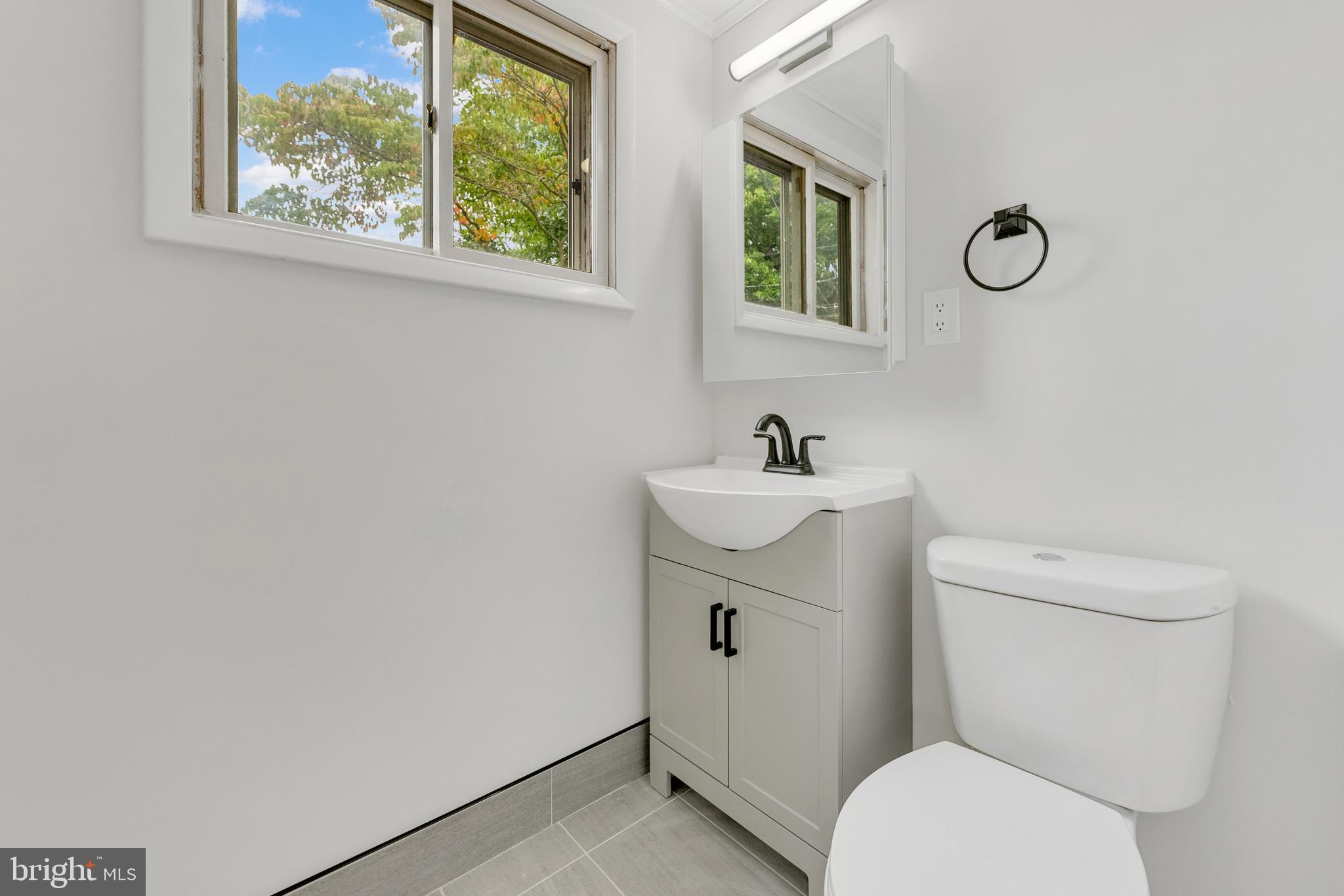 217 Pennsylvania Road Brooklawn, NJ 08030 - Photo 8 of 21 a white toilet sitting next to a bathroom sink
