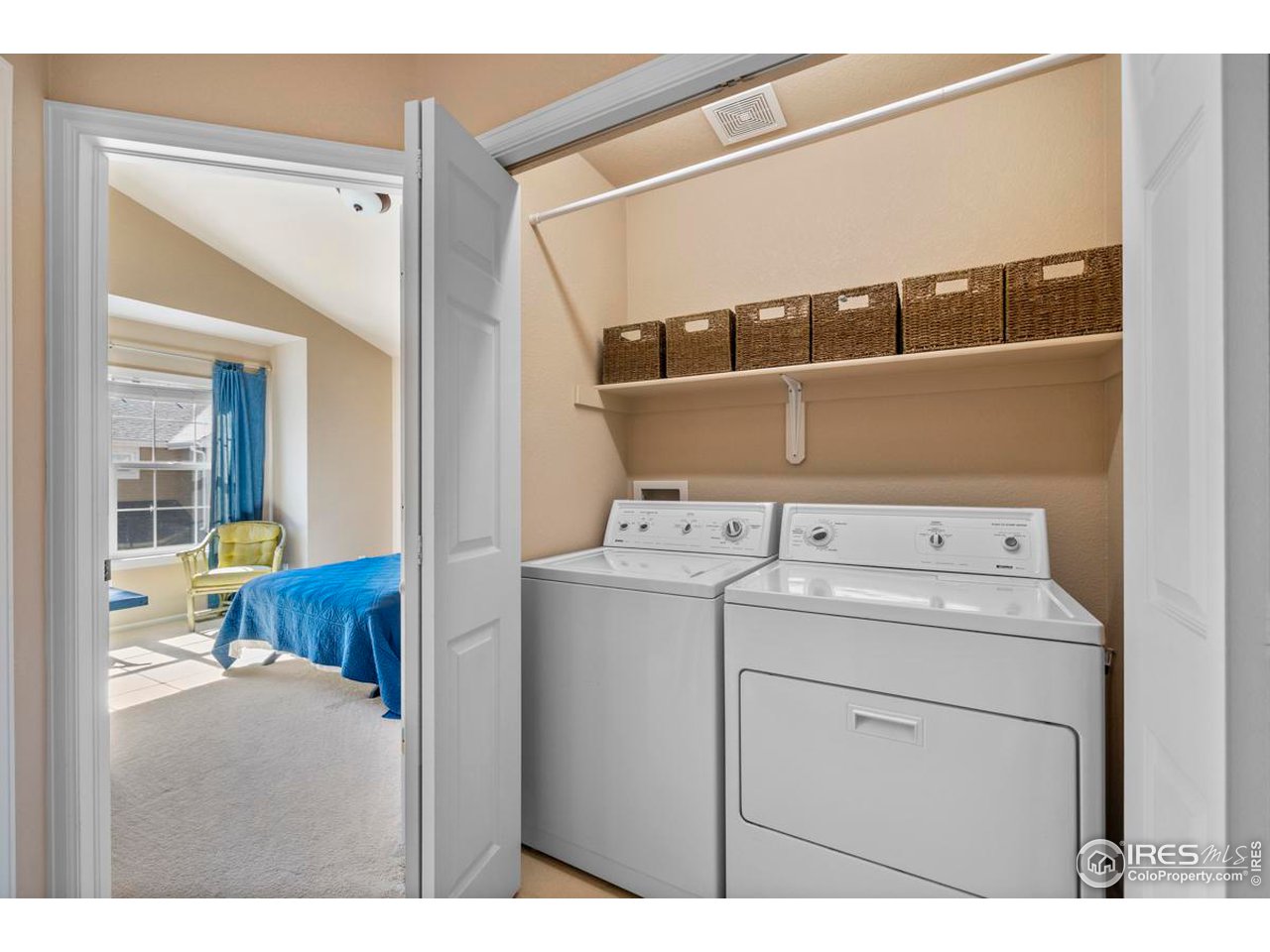 115 Bayside Circle Windsor, CO 80550 - Photo 17 of 23 a utility room with dryer and washer
