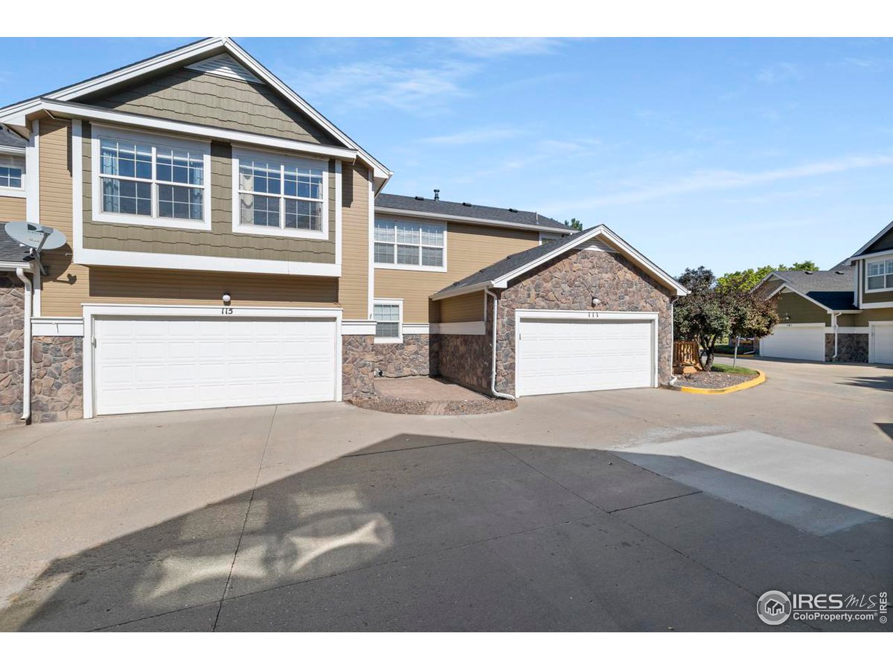 115 Bayside Circle Windsor, CO 80550 - Photo 23 of 23 a view of front of house with a yard
