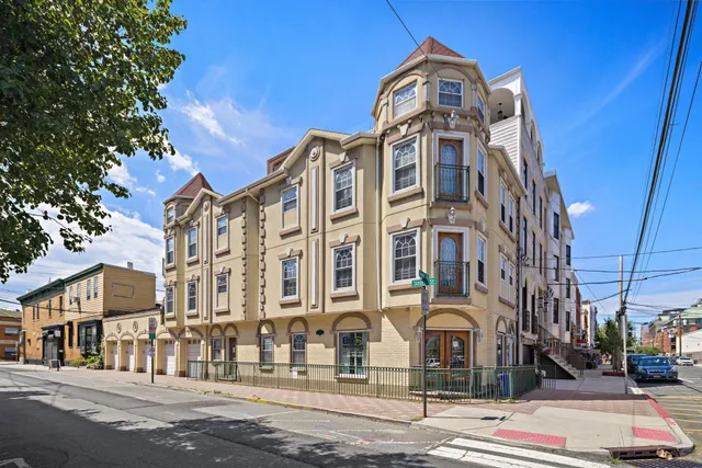 a front view of a building with a street
