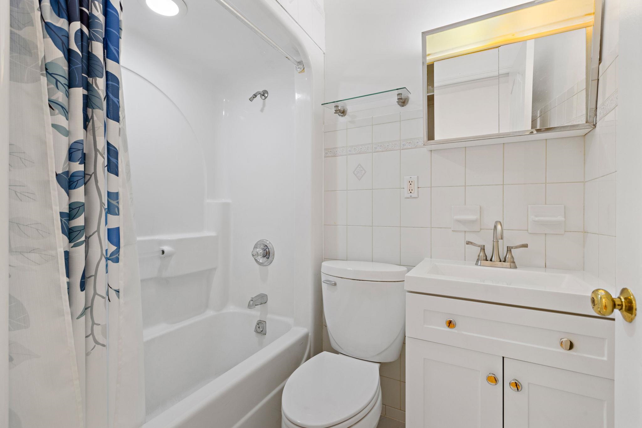 600 Grand Street, Unit 2 Hoboken, NJ 07030 - Photo 11 of 18 a bathroom with a sink toilet and shower