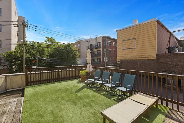 a view of a balcony with chairs