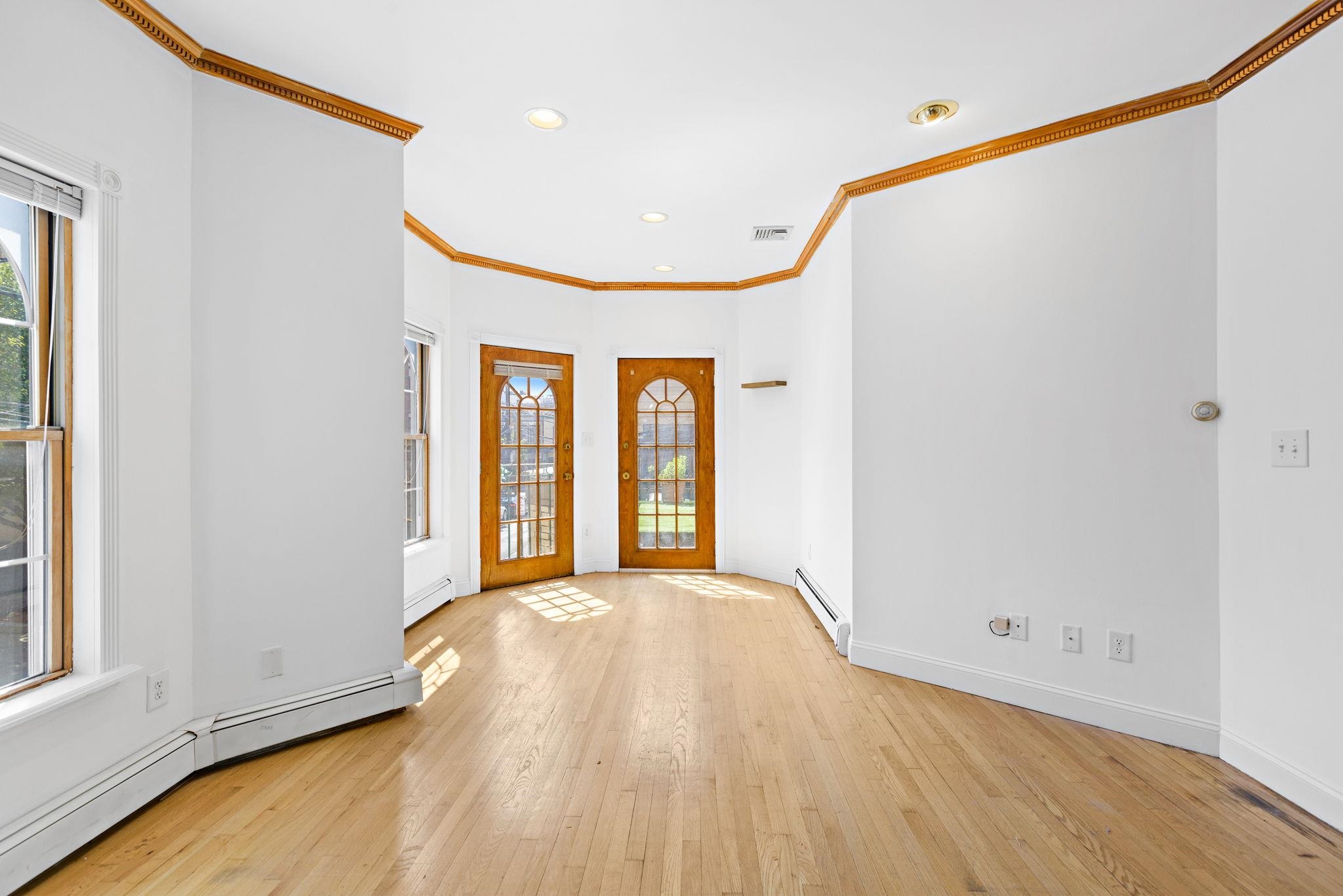 600 Grand Street, Unit 2 Hoboken, NJ 07030 - Photo 5 of 18 a view of a big room with wooden floor and windows