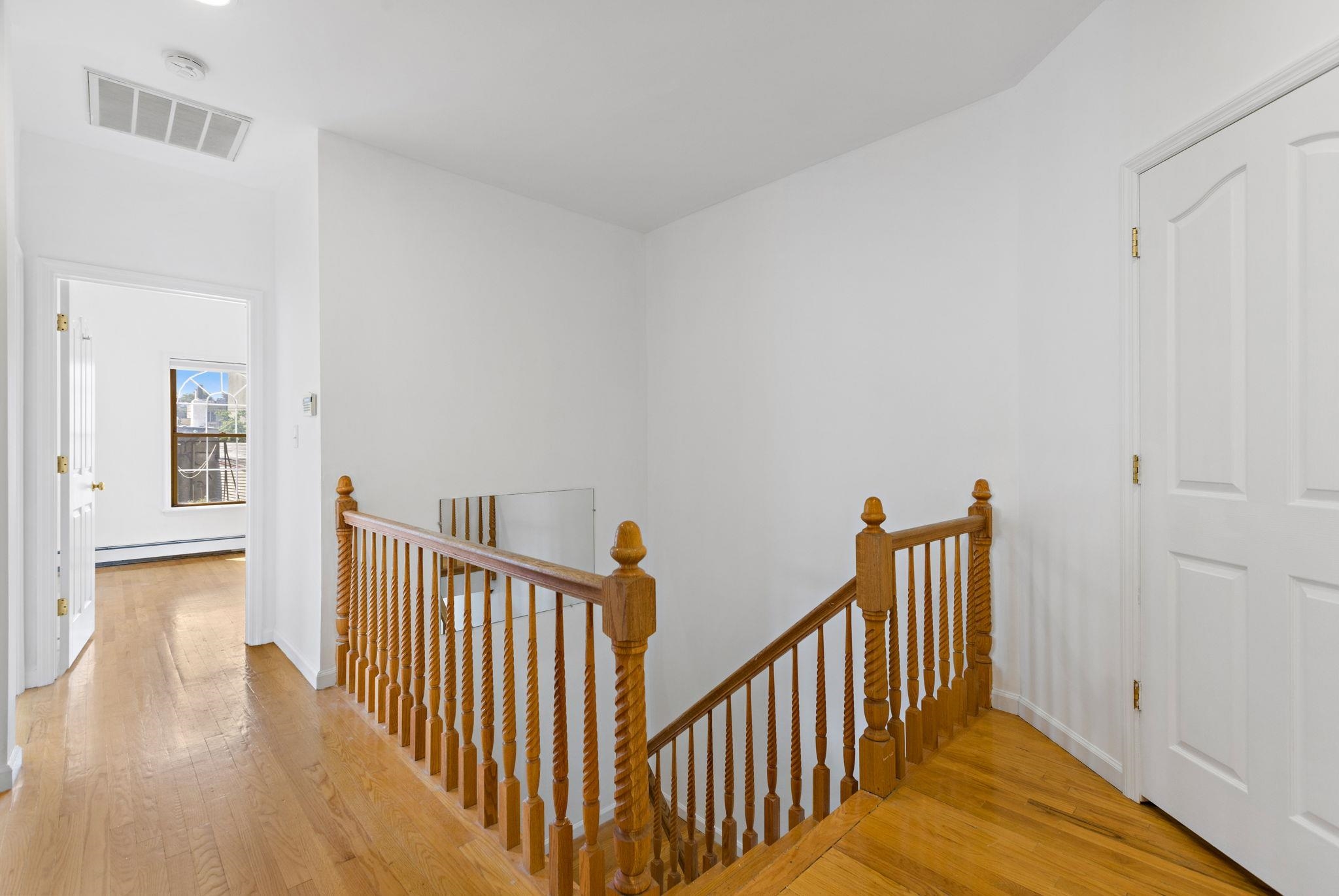600 Grand Street, Unit 2 Hoboken, NJ 07030 - Photo 10 of 18 a view of a hallway with wooden floor