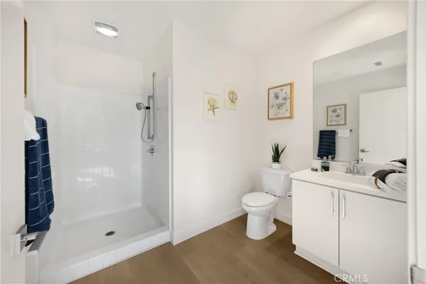 a bedroom with a bed and glass window