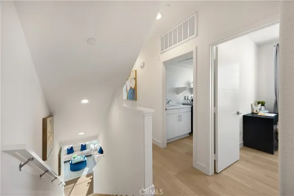 a view of a sink and washing machine in a room