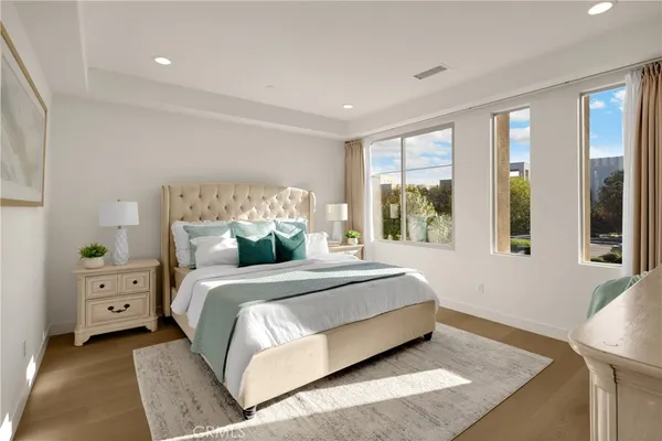 a bathroom with a double vanity sink and a window