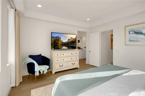 a bathroom with a double vanity sink a mirror a shower and a bathtub
