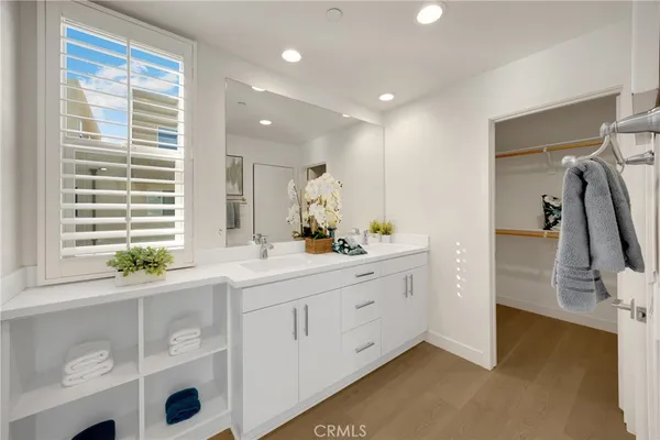 a bathroom with a sink double vanity and shower