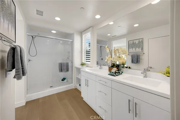 a spacious bedroom with a bed and a couch