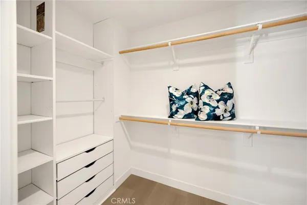 a spacious bedroom with a bed and a couch