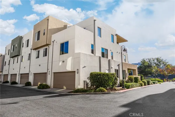 an aerial view of a house with a garden