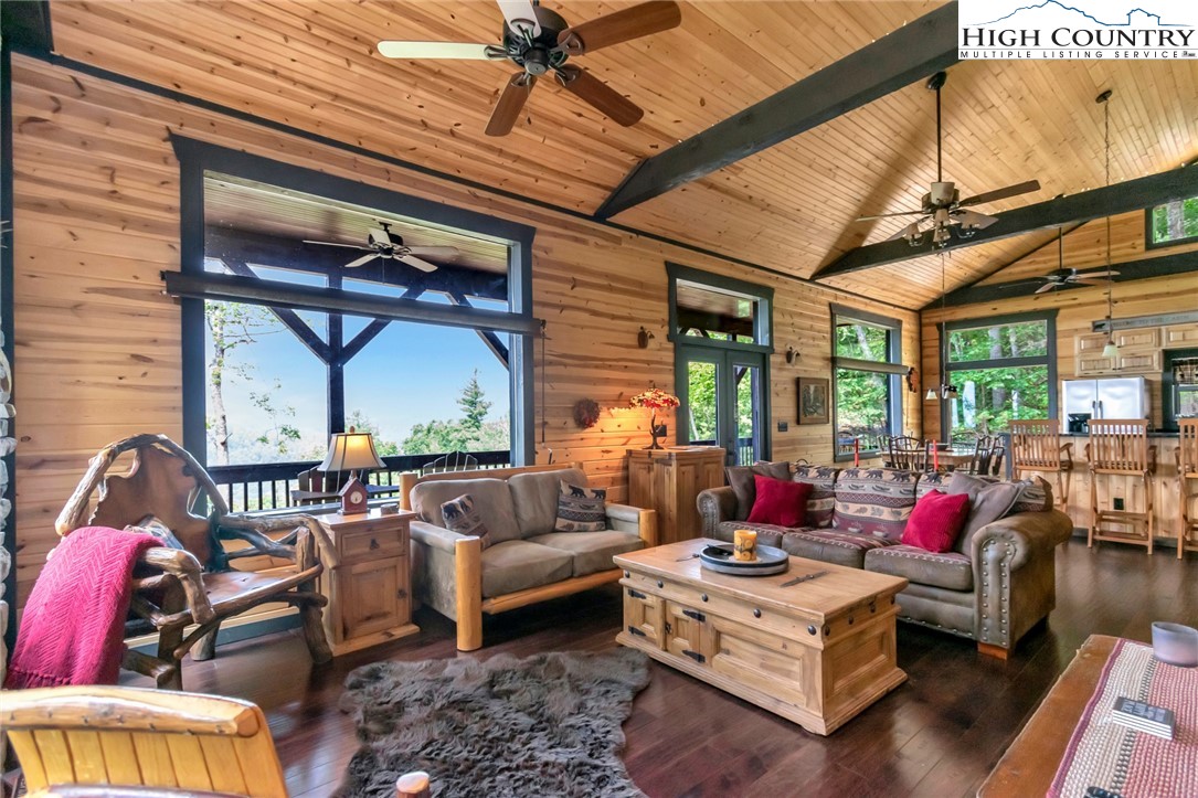 4879 Staghorn Road Purlear, NC 28665 - Photo 13 of 50 a living room with furniture and a large window