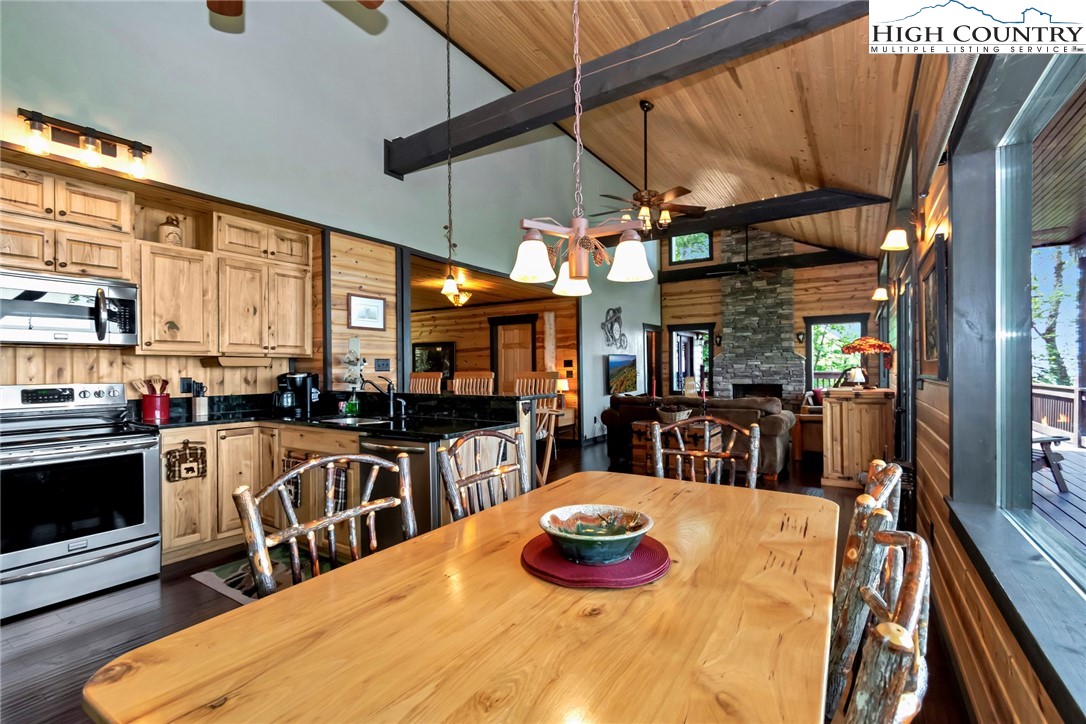 4879 Staghorn Road Purlear, NC 28665 - Photo 27 of 50 a view of a dining room with furniture