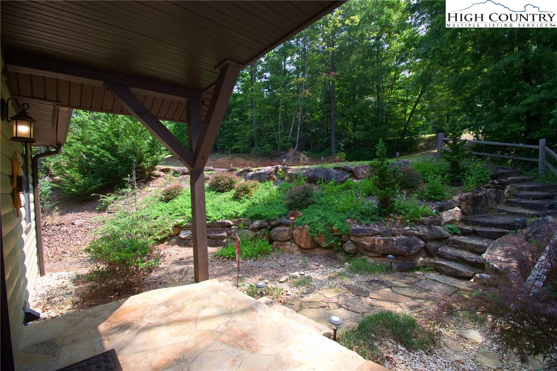 4879 Staghorn Road Purlear, NC 28665 - Photo 4 of 50 a view of backyard with plants and outdoor seating