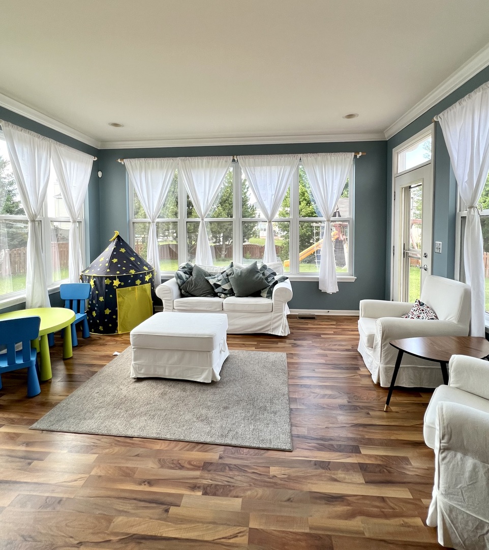 119 Reston Court Sycamore, IL 60178 - Photo 11 of 36 a living room with furniture and a large window