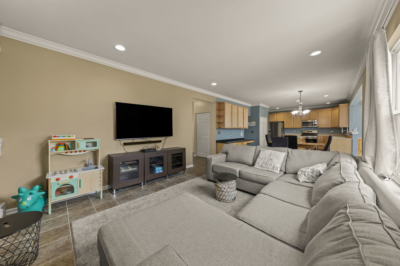 119 Reston Court Sycamore, IL 60178 - Photo 13 of 36 a living room with furniture and a flat screen tv