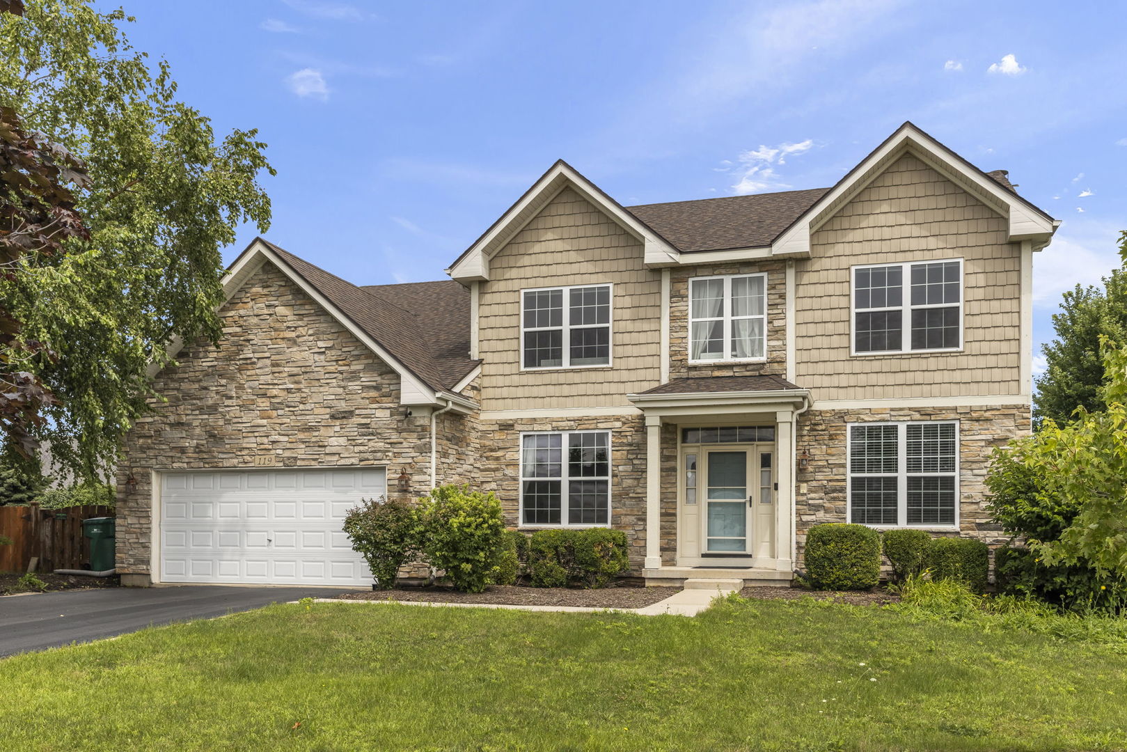 119 Reston Court Sycamore, IL 60178 - Photo 2 of 36 front view of a house next to a yard