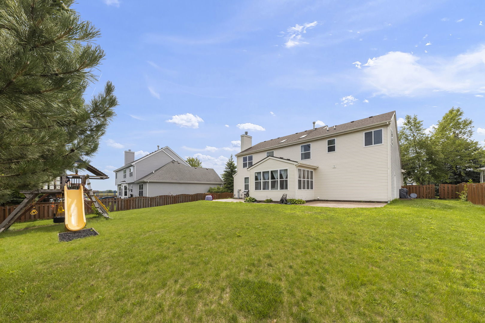 119 Reston Court Sycamore, IL 60178 - Photo 31 of 36 a view of a house with a yard and sitting area