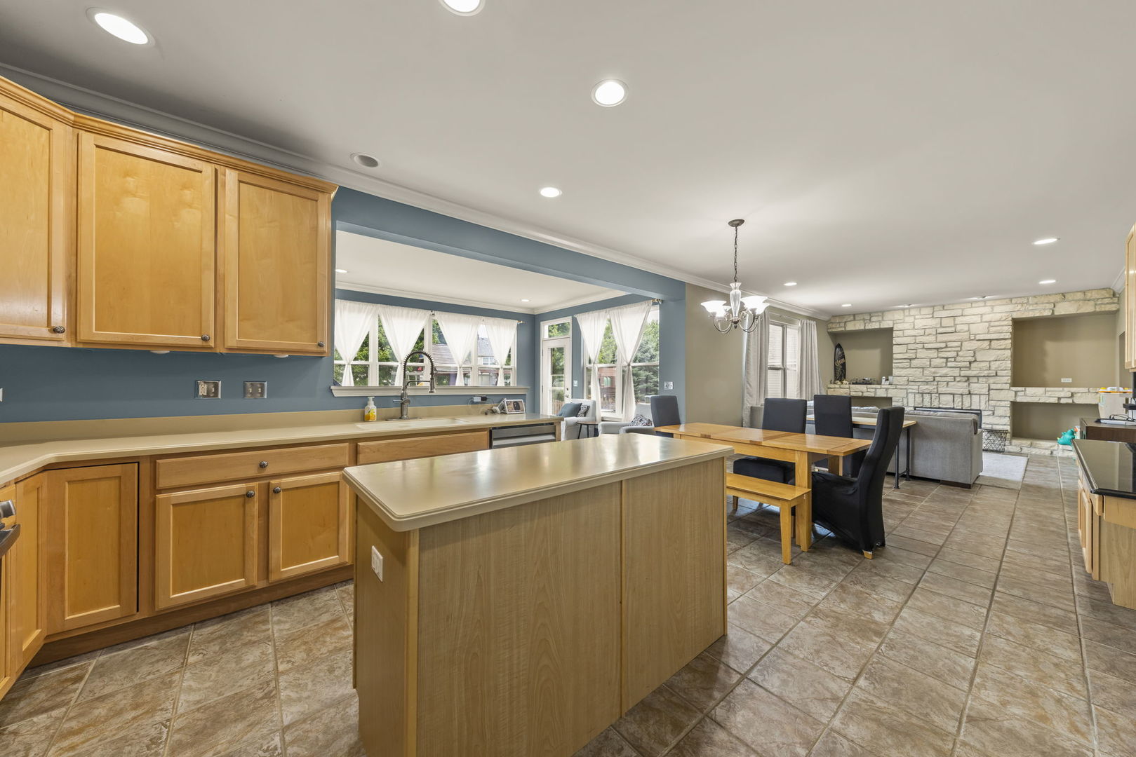 119 Reston Court Sycamore, IL 60178 - Photo 7 of 36 a large kitchen with kitchen island a large window
