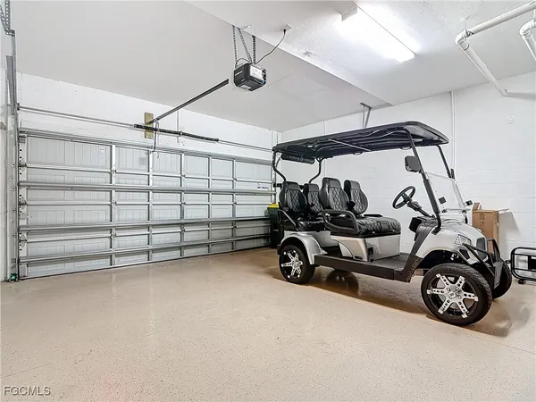 a view of a garage with parked cars
