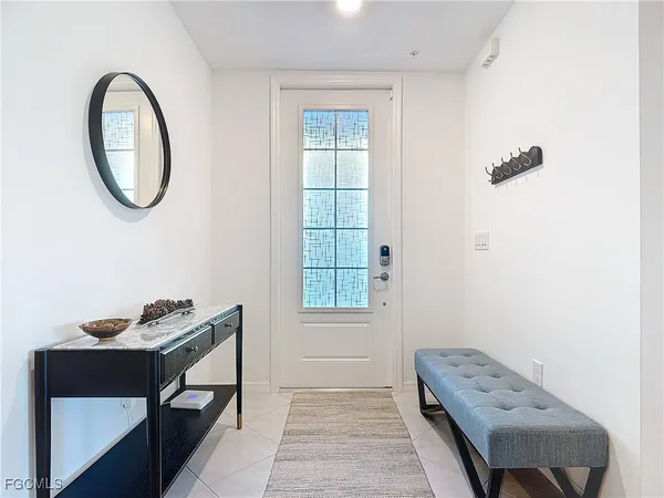 a view of a room that has a bed and a chair in it