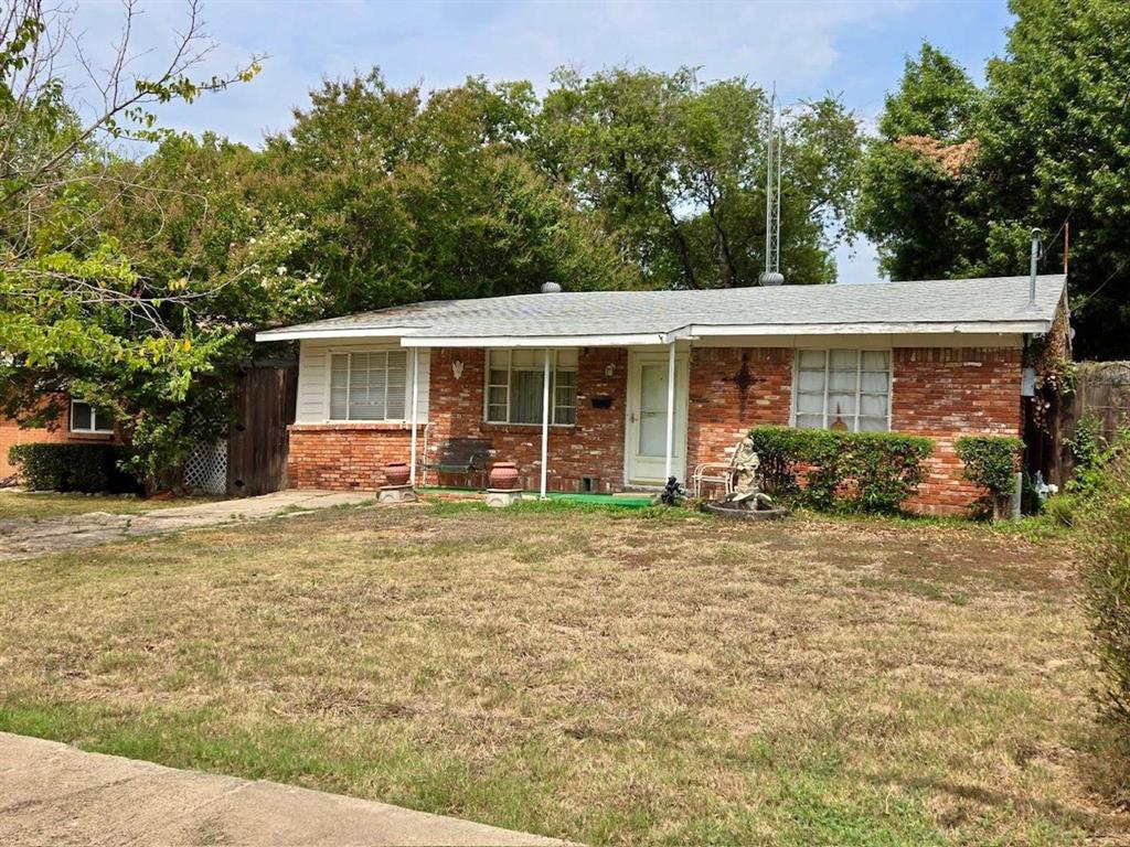 4307 Bonham Street, Unit 1 Dallas, TX 75229 - Photo 2 of 3 a front view of a house with garden