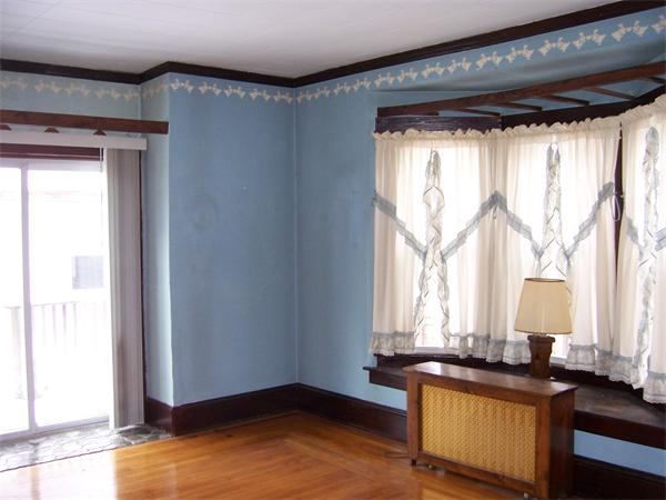 78 Manchester Terrace Springfield, MA 01108 - Photo 4 of 17 a view of a room that has a bed and a window in it