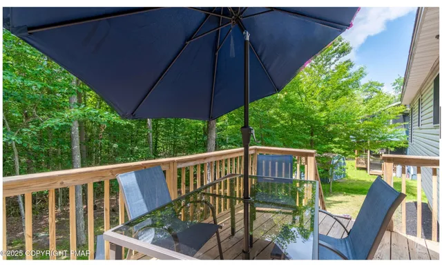 a view of a two chairs under an umbrella