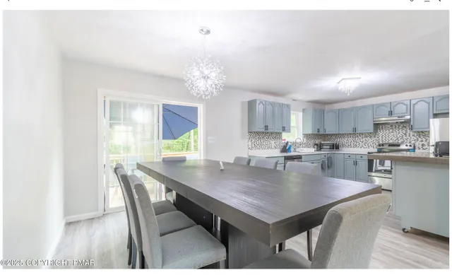 a view of a dining room and livingroom