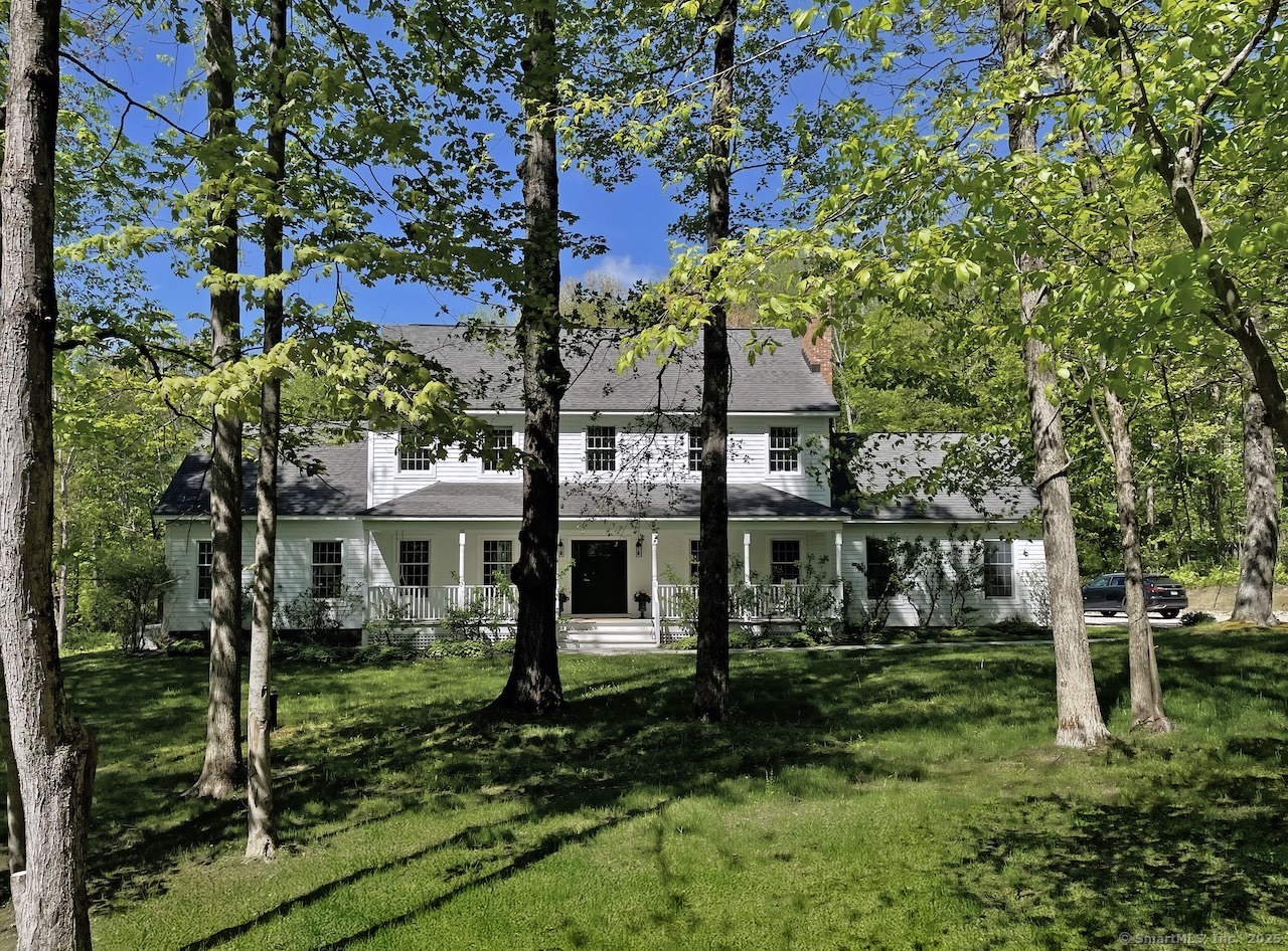 a view of a house with a yard and plants