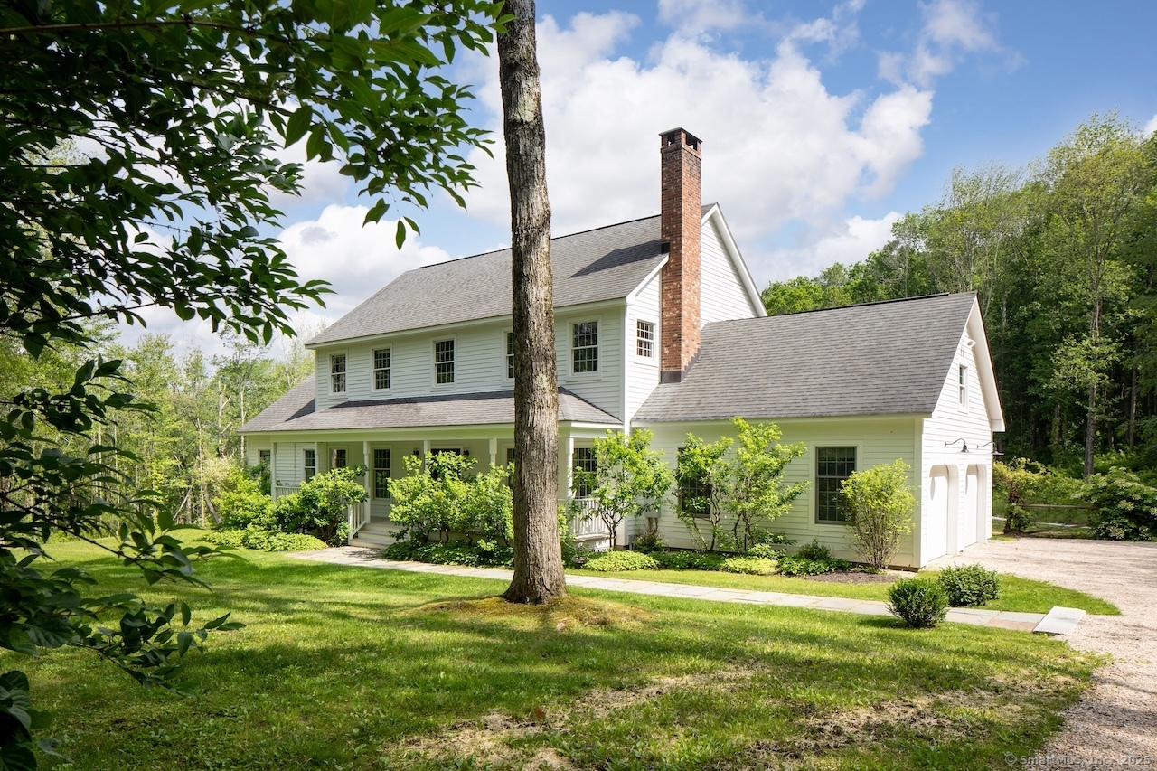 200 Sharon Mountain Road Sharon, CT 06069 - Photo 2 of 29 a front view of a house with a yard